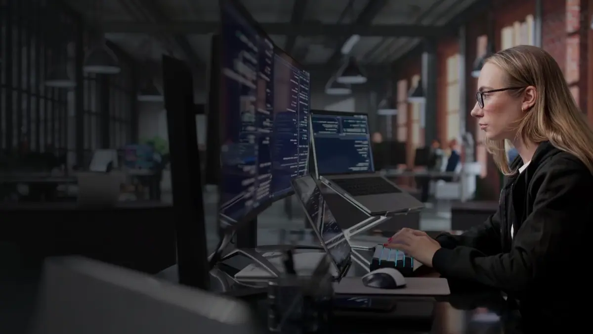 Security analyst at multiple monitors on Wipro's official CISO Command Center page